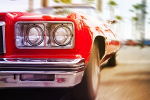 front of a red classic car