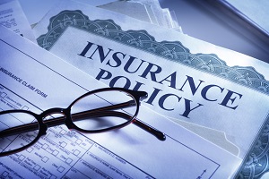 insurance policy with a pen and glasses