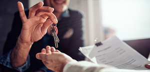 person getting keys to new home