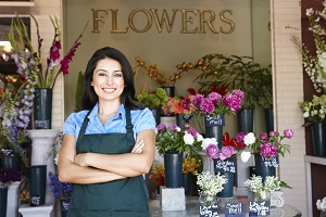 woman standing outside flower shop